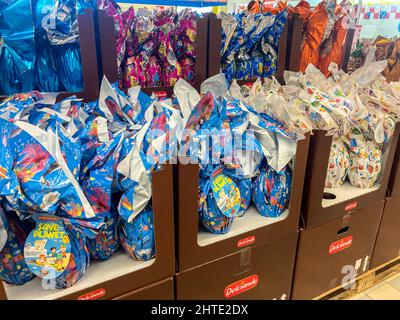 Colorful packs of Easter eggs in Italian supermarket shelves Stock Photo