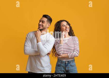 Pensive Arab Man And Woman Thinking About Something And Looking Away Stock Photo