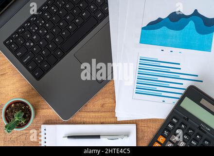 Top view photo of business workers desktop with graphics and statistics. Finance and business accounting concept. Stock Photo