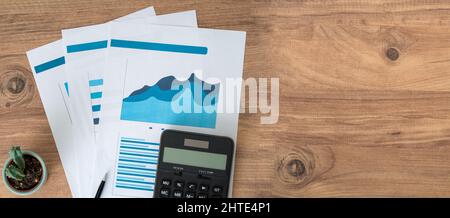 Top view photo of business workers desktop with graphics and statistics. Finance and business accounting concept. Stock Photo