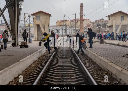 27th February 2022. Lviv Train Station, Ukraine. A group of Nigerian refugees move between platforms hoping to catch a train as desperation grows at Ukraine border as more than half a million refugees flee war - Copyright: Bel Trew/The Credit: Independent/Alamy Live News Stock Photo