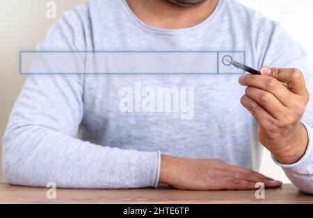 Close up photo of  a hand using tablet computer pen to use search engine. Seo management concept. Stock Photo