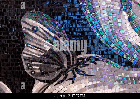 Butterfly lined with mother-of-pearl ceramic mosaic tiles. Stock Photo