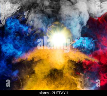 Phoenix rising in the colors of the Ukrainian and against Russian flag in smoke shapes on black background Stock Photo