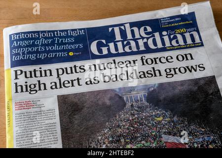 18 February 2022 Guardian newspaper headline about the Ukraine crisis reads Putin puts nuclear force on high alert as backlash grows. Stock Photo