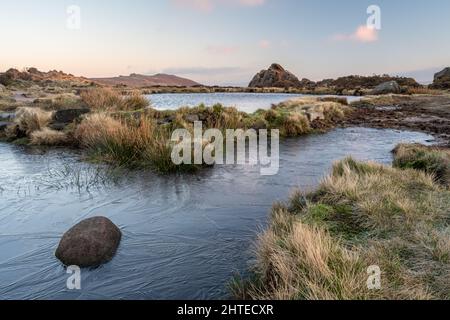 Sunrise at Doxey Pool on The Roaches, in the Staffordshire Peak District National Park. Stock Photo