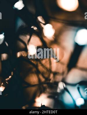 Dark blurred image with burning light bulbs Stock Photo