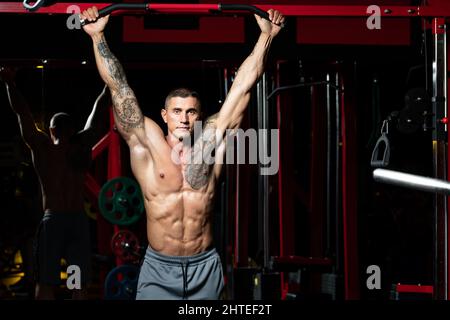 Athlete Performing Hanging Leg Raises Exercise Ab Exercises Stock Photo