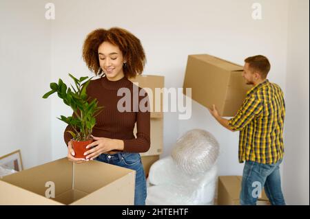 Happy couple packing cardboard box Stock Photo