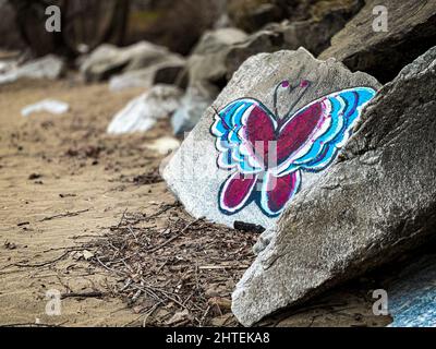 Butterfly painting on a rock at Durand Eastman Beach, New York, United states of America Stock Photo