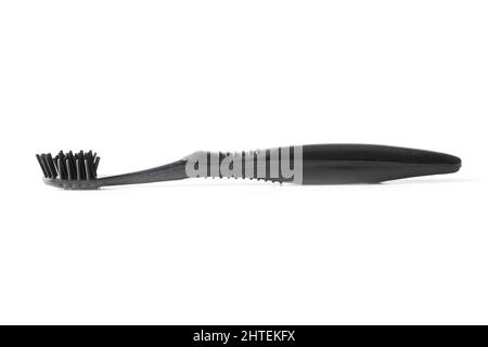 Black plastic toothbrush closeup isolated on white Stock Photo