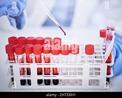 DNA never lies. Cropped shot of a lab technician holding vials of blood. Stock Photo
