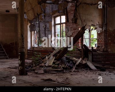 A view of an abandoned house with broken windows Stock Photo