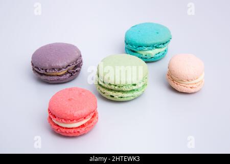 Close-up top view of colorful macaroons isolated on a white background Stock Photo