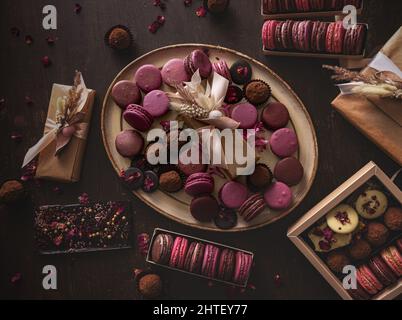 Tasty sweet pink macarons, still life, top view Stock Photo