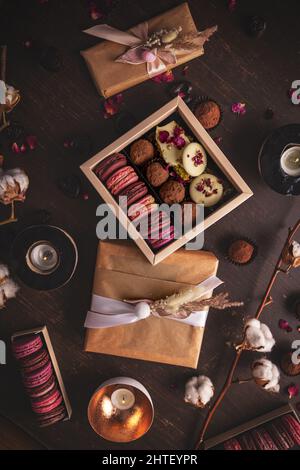 Dessert box composition on dark background, still life, top view Stock Photo