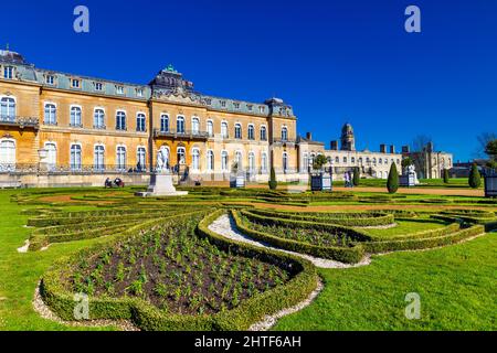 Exterior of early 18th century country mansion Wrest House and topiary of the French Parterre Garden, Wrest Park, Bedfordshire, UK Stock Photo