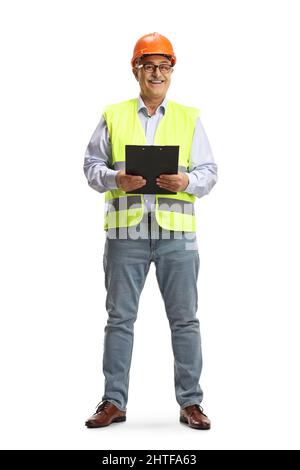 Full length portrait of a smiling mature male engineer holding a clipboard isolated on white background Stock Photo
