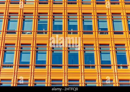 Close up view of windows in a modern, contemporary office block. Windows are in regular, uniform geometric rows and columns Stock Photo