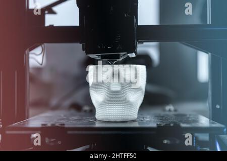 The 3D printer prints white plastic model Stock Photo