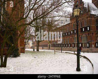 Window with shutters on an ancient building of the province of Groningen with some snow in the winter Stock Photo