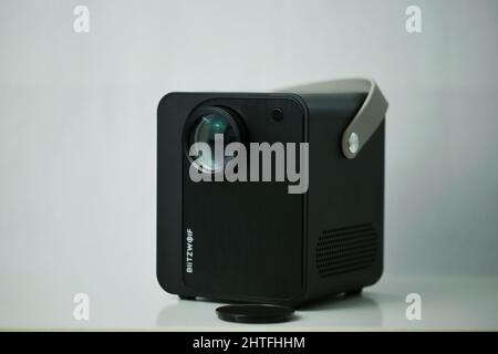 Photo of Blitzwolf portable projector with remote control isolated on a white background Stock Photo