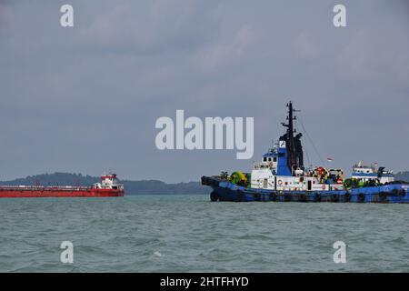 Tugboat sailing in the sea. Tugboat making maneuvers, Tanjung Pinang Riau Islands, August 6, 2019 Stock Photo