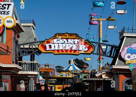 Sign Giant Dipper with red and yellow pattern color in Santa Cruz Boardwalk beach. California, USA. Stock Photo