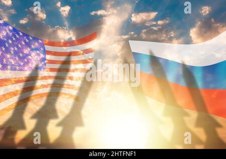 Shadows of missile warheads on the background of Russian and American flags. Sunset in the background. The concept of a military conflict between USA Stock Photo