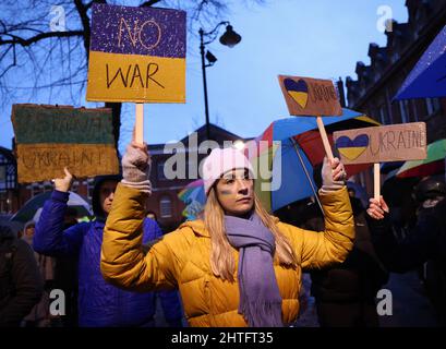 Leicester, Leicestershire, UK. 28th February 2022. A demonstrator attends a vigil after Russian President Vladimir Putin ordered the invasion of Ukraine. Hundreds of people gathered outside the Town Hall to show their support to Ukraine. Credit Darren Staples/Alamy Live News. Stock Photo