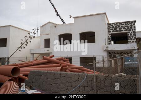 buildings being demolished to make way for unfinished new hotel buildings held up by covid in Lanzarote, canary islands, spain Stock Photo