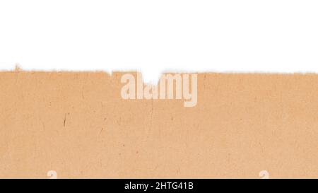 Old yellow craft paper torn edge. Isolated on white background, clipping path included Stock Photo