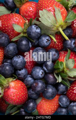 Full frame shot of fresh strawberries with blueberries, copy space Stock Photo