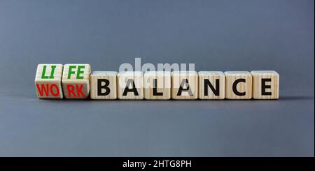 Work life balance symbol. Turned wooden cubes and changed concept words ...