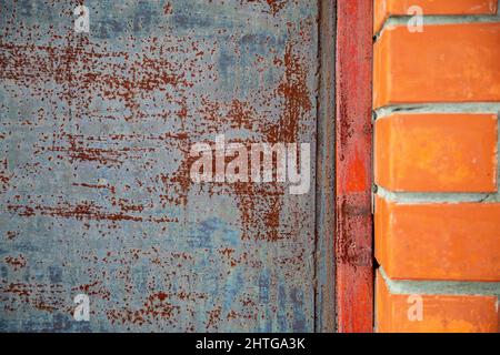 Old rusty metal background with remnants of gray-blue paint Stock Photo