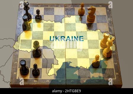 War in Ukraine, chess like geopolitics game between Russia, EU and USA. Ukraine map on chessboard. Concept of political tension, war, crisis, conflict Stock Photo
