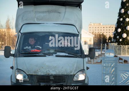 Portrait of a driver in the cabin of a truck driving with a partner Stock Photo