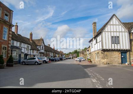 Lacock,UK-Sept 2021: View for main road in small a village Lacock in UK, many old grade one listed historic buildings on High Street. Small town in Stock Photo