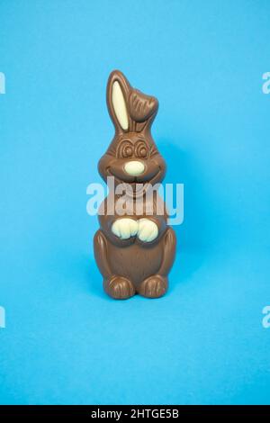Easter chocolate bunny on a blue background vertically Stock Photo