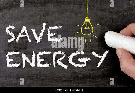 Save Energy - chalkboard with lamp drawing Stock Photo