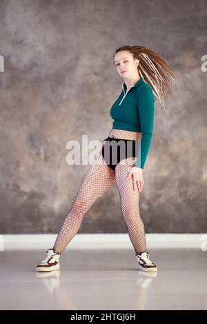Female twerk dancer rehearsing dance in gym. Stock Photo
