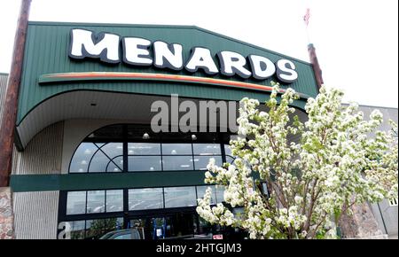 Menards Store selling building and repair materials for the home with a beautiful blooming fruit tree in the entrance patio. St Paul Minnesota MN USA Stock Photo