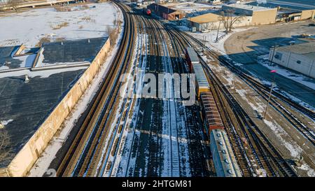 Empty railyard in winter that has snow on the ground Stock Photo
