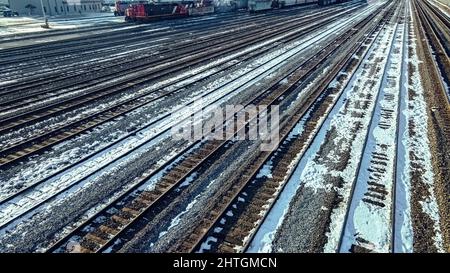 Empty railyard in winter that has snow on the ground Stock Photo