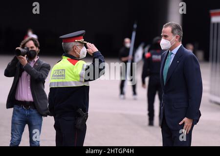The Commissioner of the Catalan Police, Miquel Esquius, head of the South Metropolitan Police Region receives the King of Spain Felipe VI with a military salute upon his arrival at the Mobile Word Congress in Hospitalet de Llobregat Barcelona.The GSMA Mobile World Congress, which is held annually, brings together pioneering telecommunications companies where they present their latest smartphones and portable devices with the new 5G technology as a novelty this edition. 150 countries participate with a total of 1500 exhibitors except for Russia's invasion of Ukraine, the organization has elimin Stock Photo