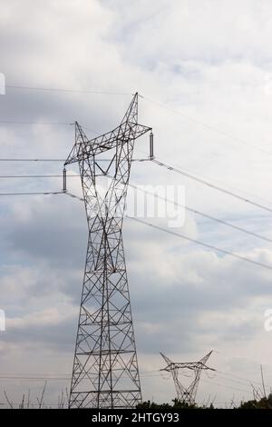 Electrical tower or high-rise electrical support that serves as a support for the transmission lines of electrical energy generated by a nuclear power Stock Photo
