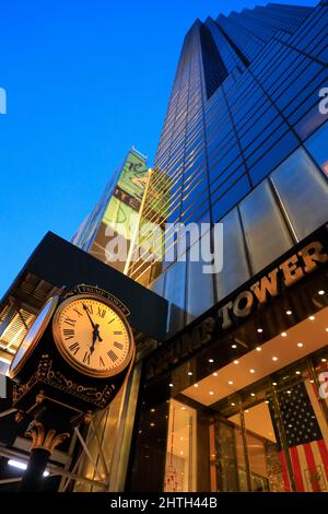 Entrance of Trump Tower on 725 5th Avenue with Trump Tower clock at dusk.Midtown Manhattan.New York City.New York.USA Stock Photo