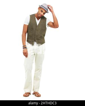 Trend setter. Full-length portrait a handsome trendy young man tipping his hat to you, isolated on white. Stock Photo