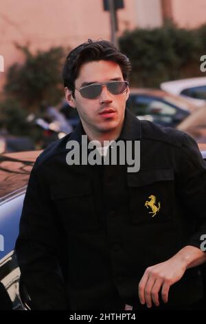Milan, Italy. 27th Feb, 2022. Guest at Ferrari fashion show during the Milan Fashion Week Fall/Winter 2022/2023 on February 27, 2022 in Milan, Italy. Credit: Independent Photo Agency/Alamy Live News Stock Photo
