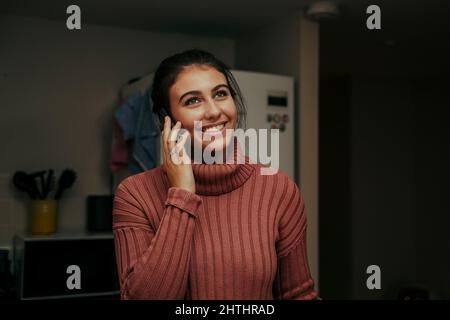 caucasian female talking on cellular device smiling Stock Photo